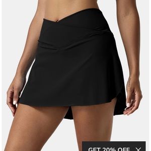 Halara Black Cross Over Skirt with built in shorts. NWT.